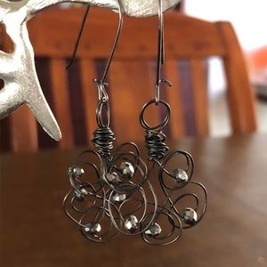 Floral shaped wire and bead drop earrings.